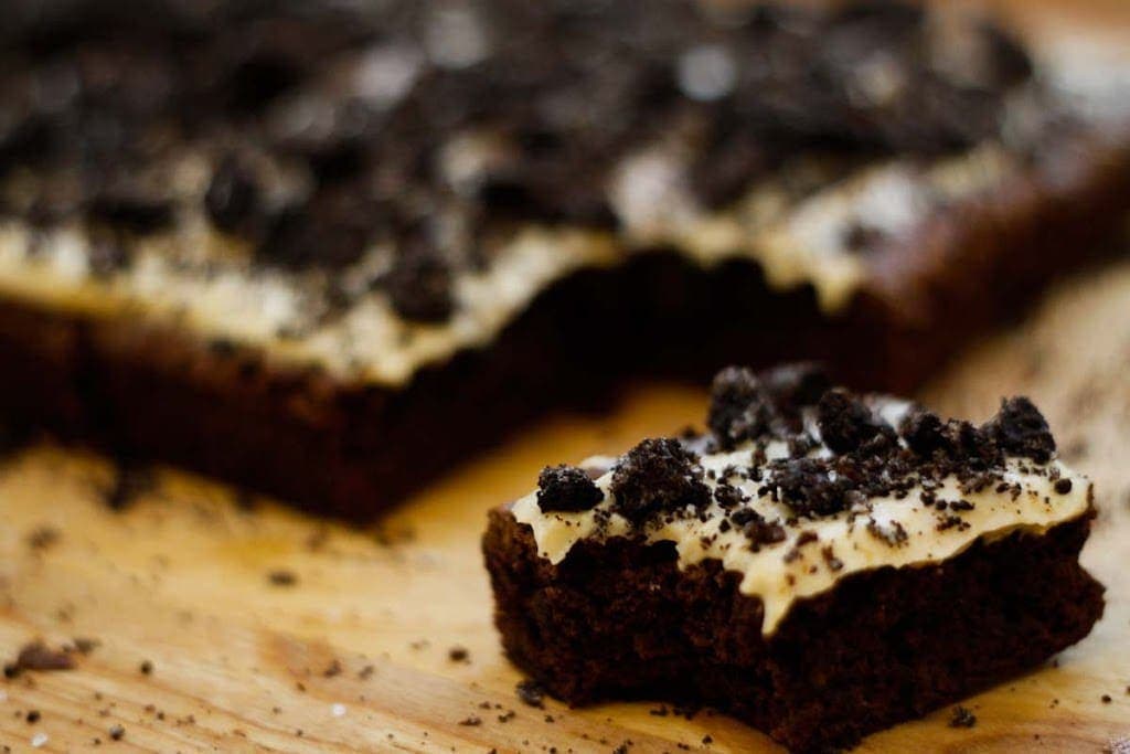 Brownies with espresso cream cheese frosting, crushed oreos, and sea salt