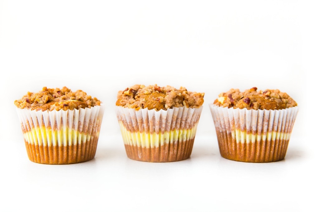 Broma Bakery | The Ultimate Pumpkin Muffins: luscious pumpkin muffins with a cheesecake center and almond streusel topping!