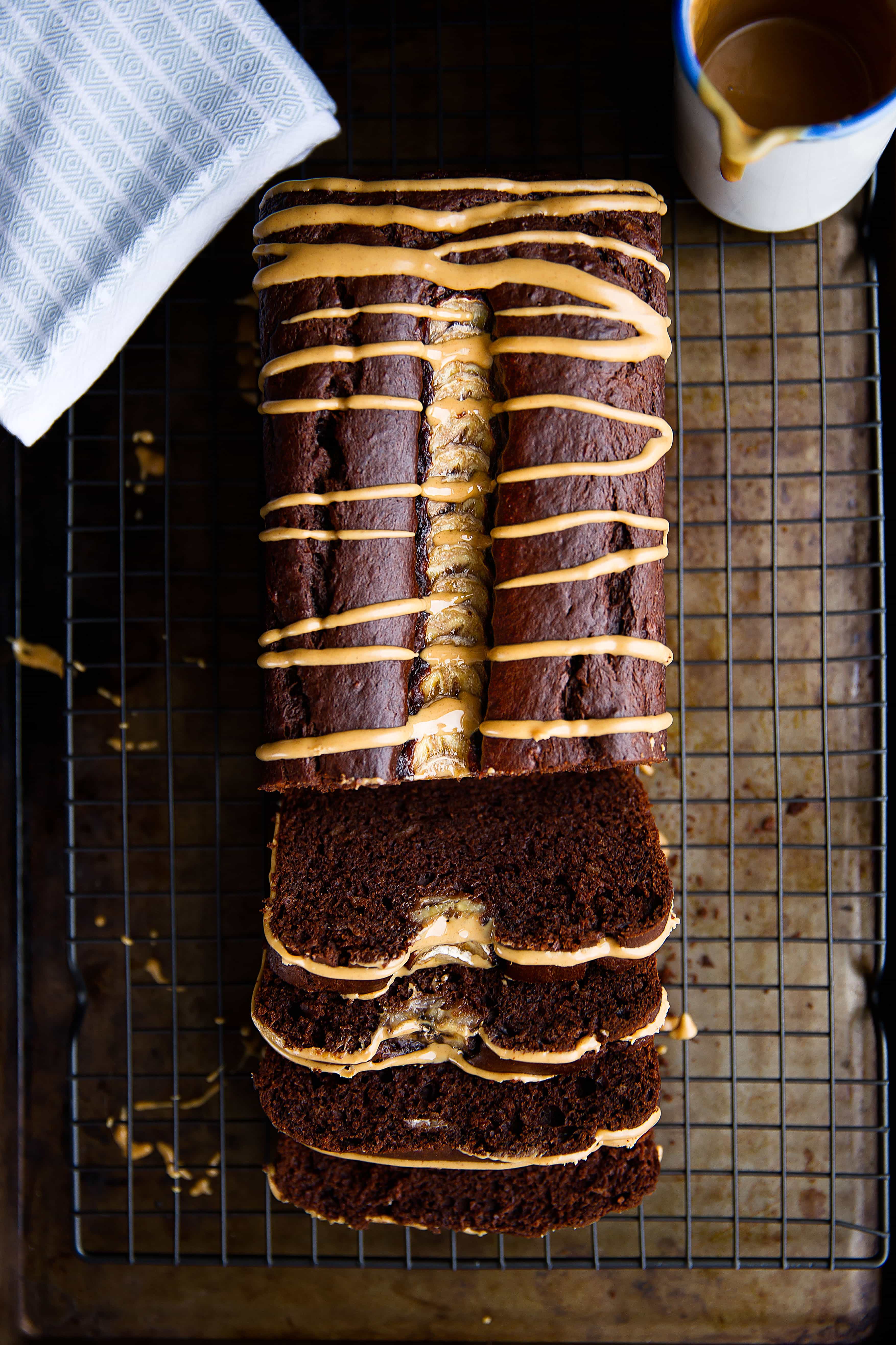 All my favorite flavors wrapped up into one quick bread? This decadent Peanut Butter Chocolate Banana Bread has us DROOLING.