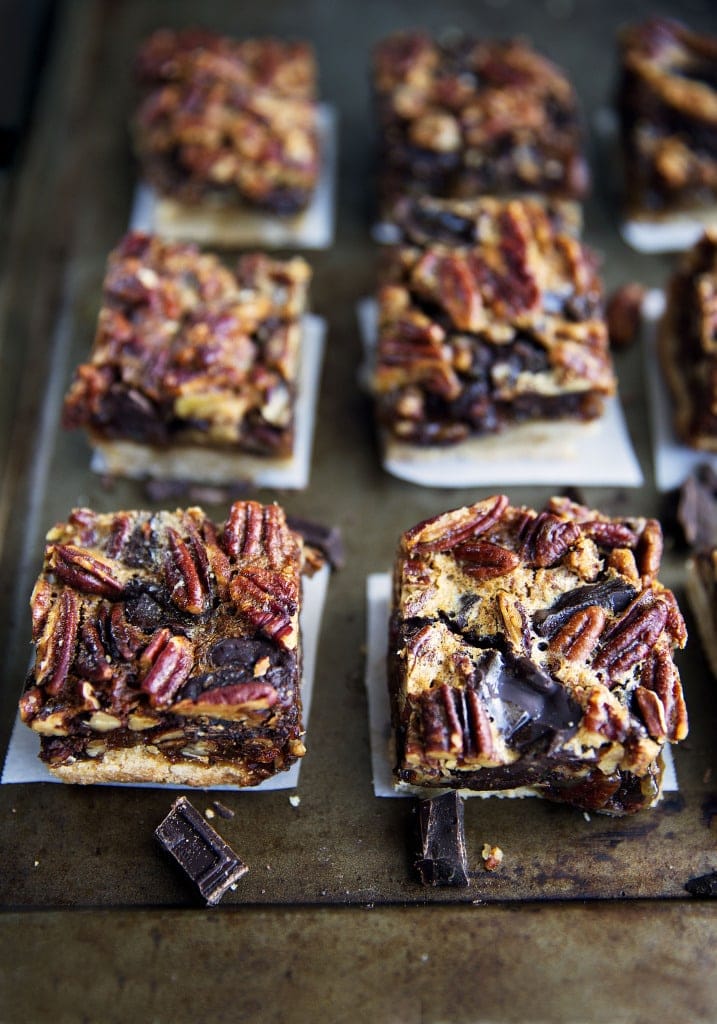 Thanksgiving is just around the corner. These Bourbon Chocolate Pecan Pie Bars will become your family's favorite recipe for years to come! | via Broma Bakery | #pecanpie #bourbonpecanpie #bars