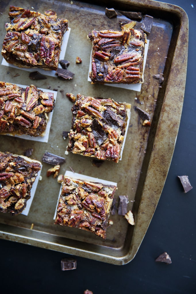 Thanksgiving is just around the corner. These Bourbon Chocolate Pecan Pie Bars will become your family's favorite recipe for years to come! | via Broma Bakery | #pecanpie #bourbonpecanpie #bars