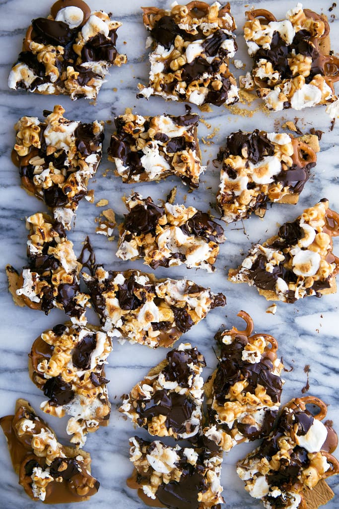 This loaded bark is made with graham crackers, pretzels, peanuts, toffee, popcorn, chocolate, and toasted marshmallows. Betcha can't eat just one!