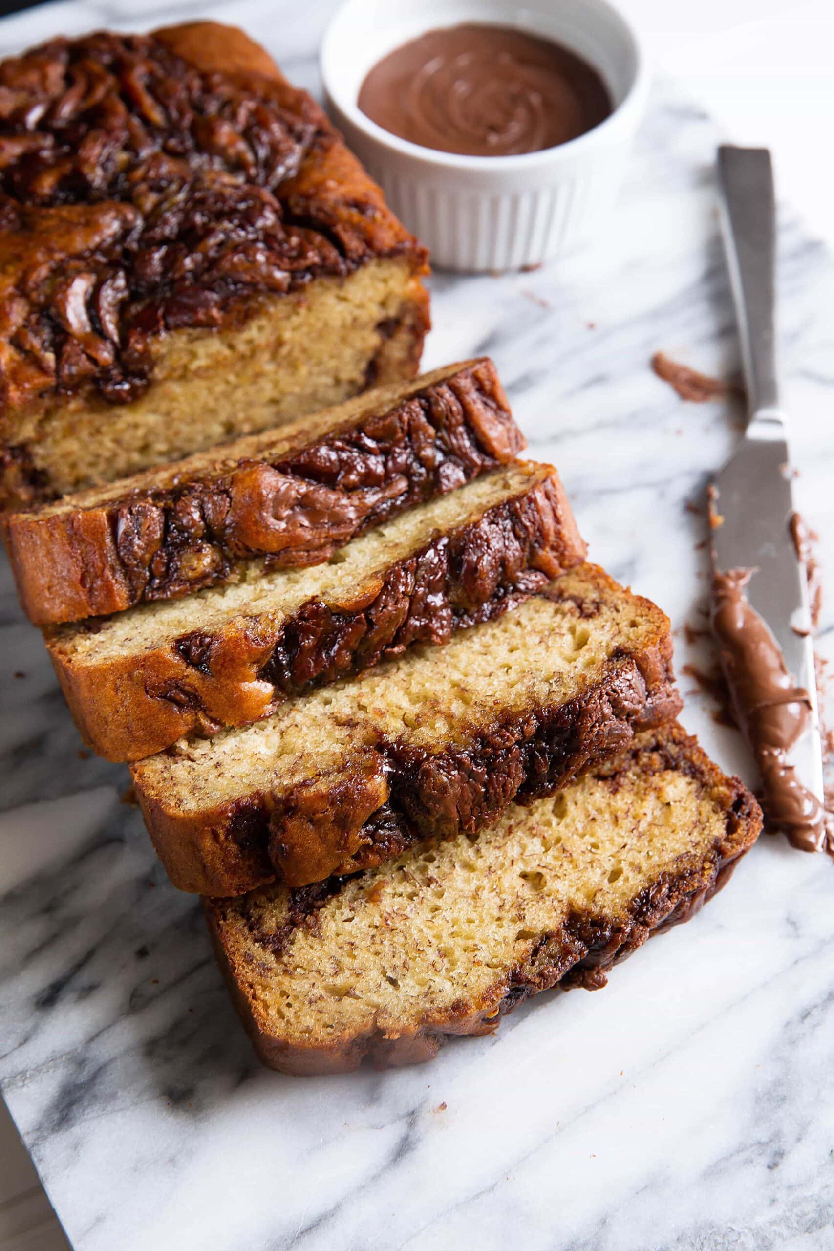 The softest banana bread you've ever had swirled with thick ribbons of Nutella. And with only 6 tablespoons of butter in the entire loaf it's practically low-fat!