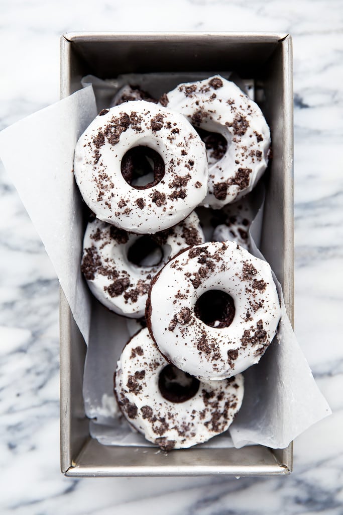 oreo donuts topped with crushed oreos in baking pan