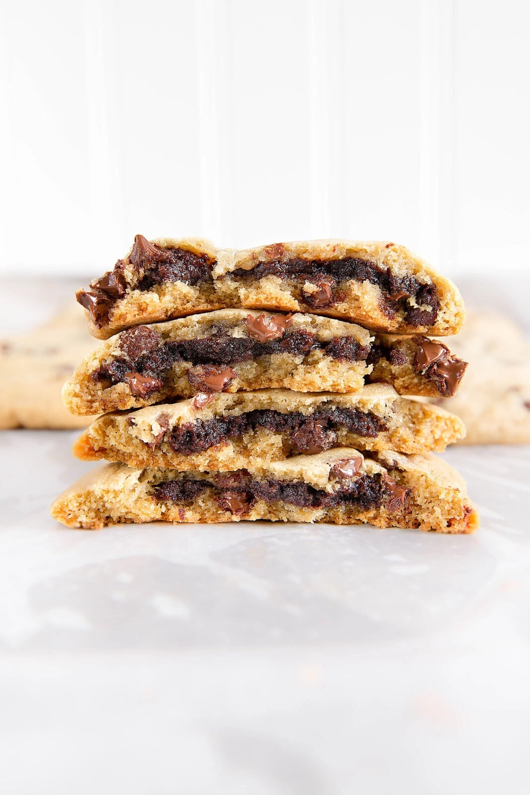 Brownie stuffed chocolate chip cookies combine the best of both worlds- a fudgy brownie center and soft and chewy chocolate chip cookies! These babies are dangerously good.
