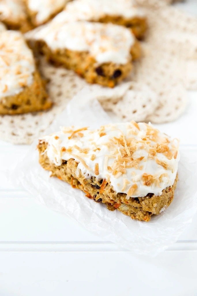 Moist and delicious Carrot Cake Scones topped with a sinful coconut cream cheese frosting are a perfect weekend breakfast!