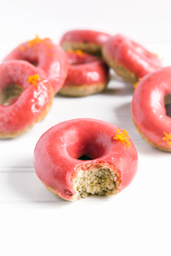 Baked Rhubarb Orange Glazed Donuts: soft and fluffy rhubarb donuts flavored with orange and dipped in a tangy rhubarb glaze!