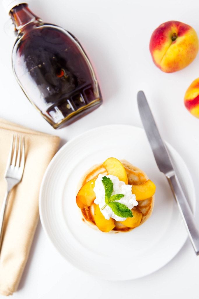Bourbon Peach Pancakes topped with bourbon-soaked peaches make for the perfect weekend breakfast!