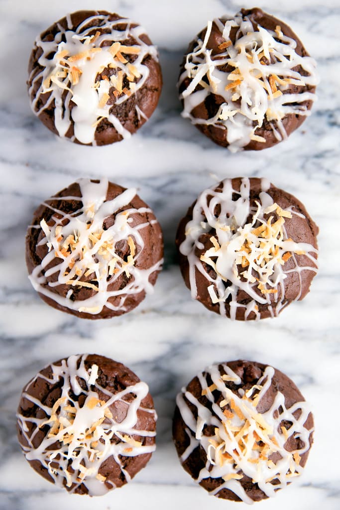 Fluffy Double Chocolate Coconut Muffins made with coconut oil and topped with a coconut drizzle!