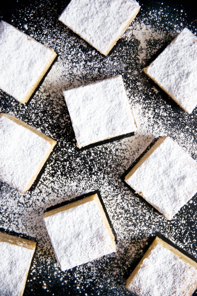 white chocolate brownies topped with powdered sugar