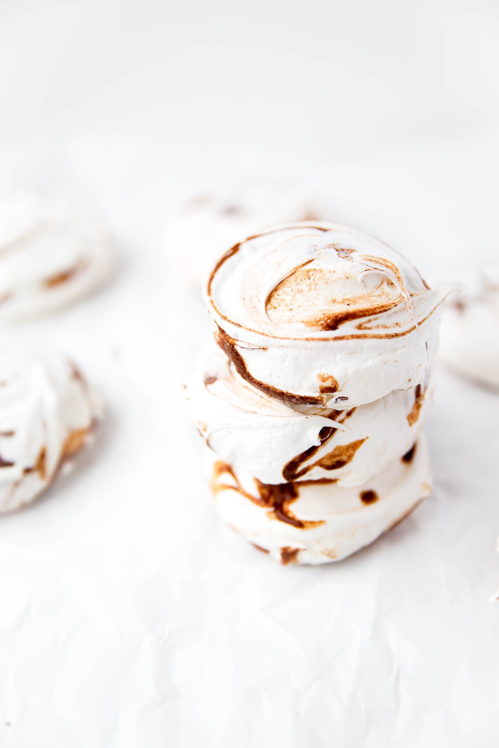 Nutella Meringues: Pillowy meringue cookies swirled with ribbons of rich nutella.