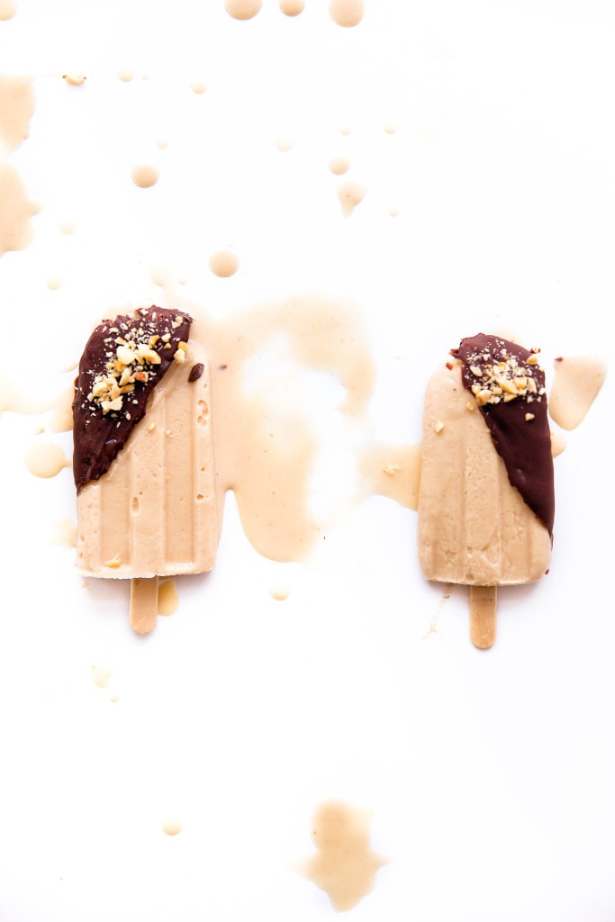 Elvis's favorite combo, peanut butter and banana, come together in popsicle form along with a sinful dip of chocolate in these Elvis Popsicles!  