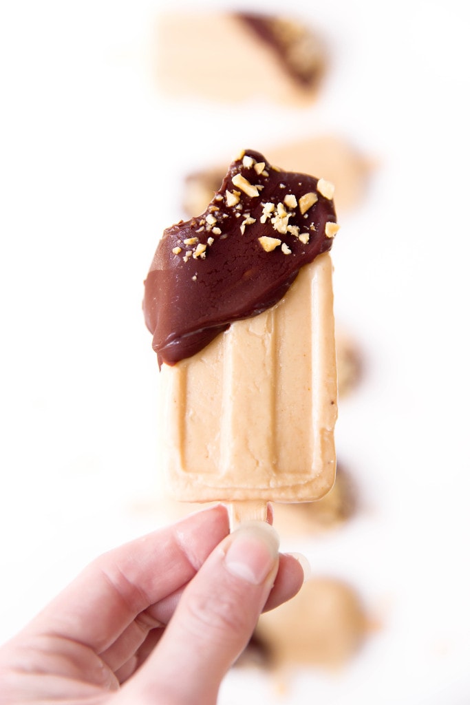 Elvis's favorite combo, peanut butter and banana, come together in popsicle form along with a sinful dip of chocolate in these Elvis Popsicles!  