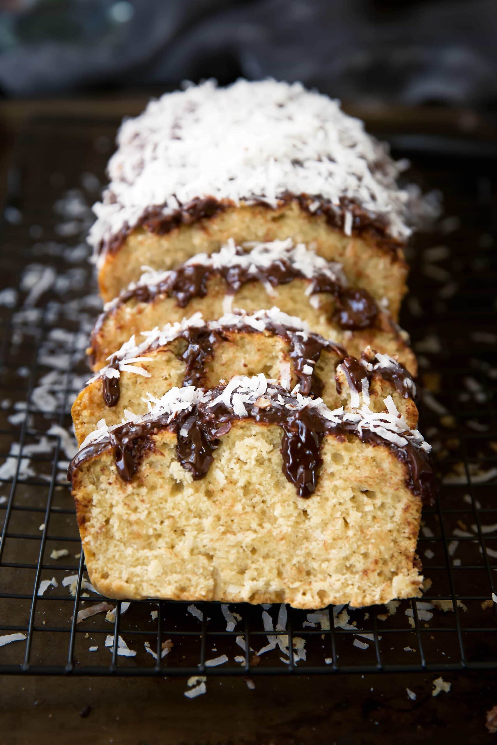 One hour is all it takes for this moist coconut loaf drizzled with chocolate ganache and shredded coconut!