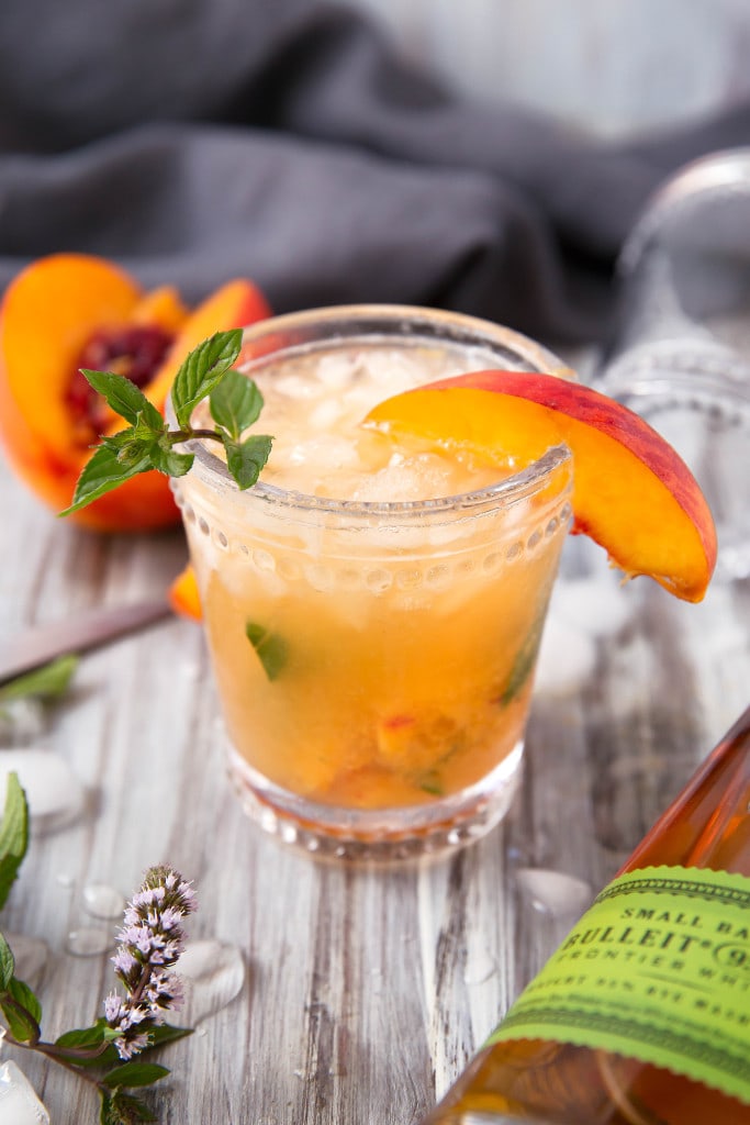 The classic mint julep gets a twist with this mouth-watering Peach Julep!