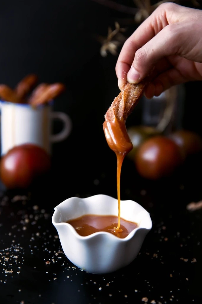 Just in time for fall: light and airy apple cider churros with salted caramel sauce perfect for dunking! 