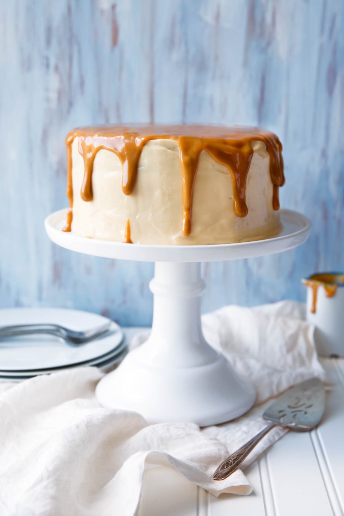 A fragrant banana layer cake made with homemade dulce de leche frosting!