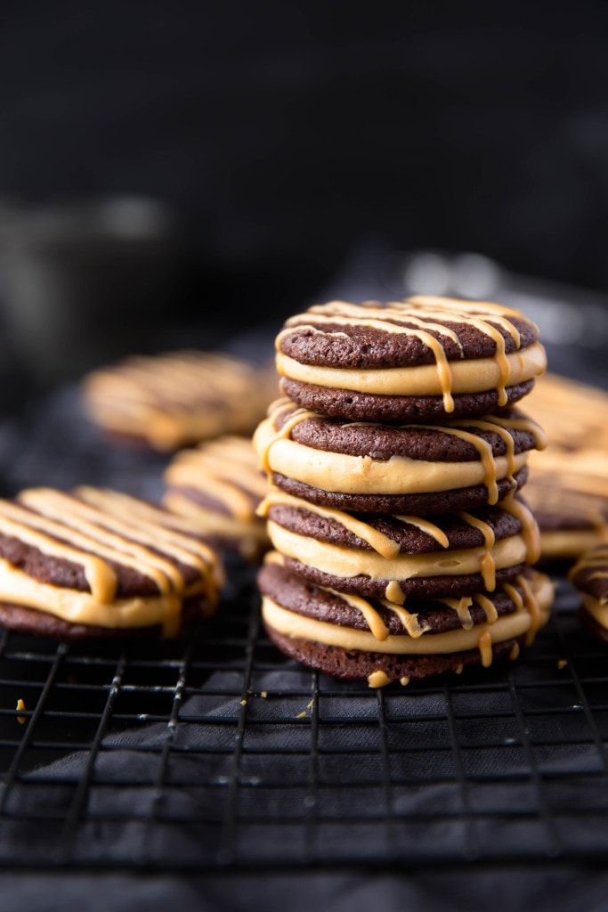 Dark Chocolate Peanut Butter Sandwich Cookies: a fluffy peanut butter frosting sandwiched between two brownie-like cookies.
