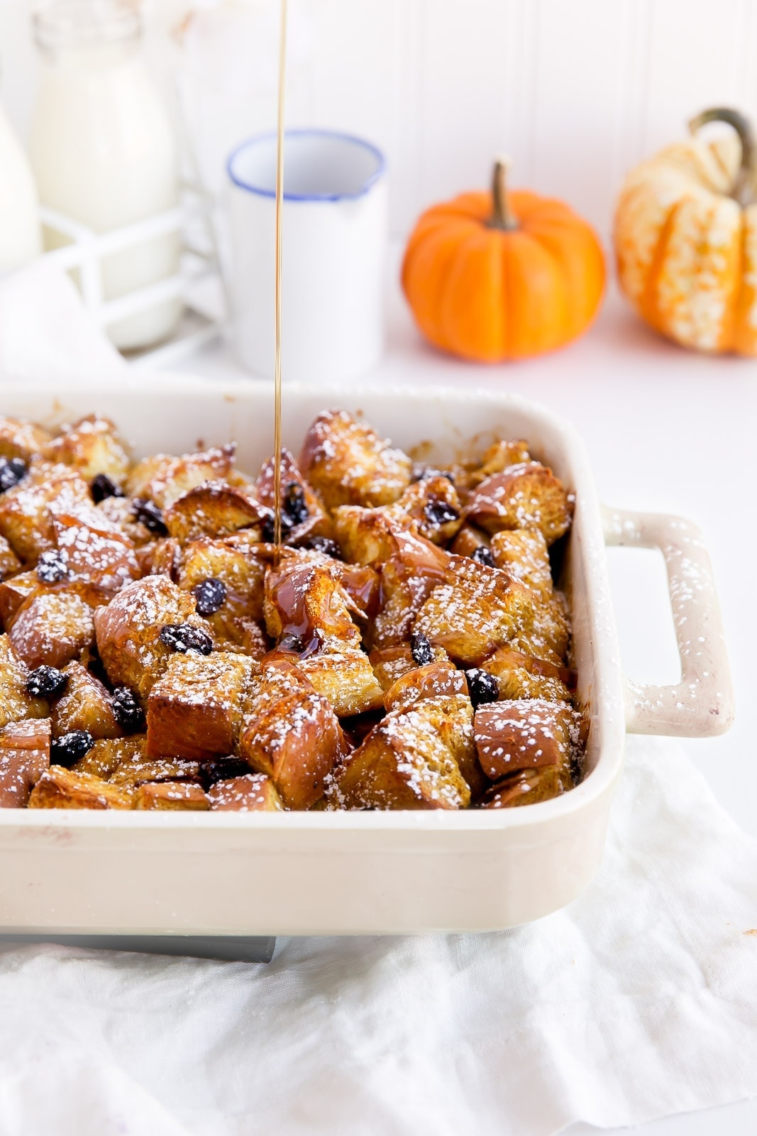 A custard-like overnight french toast bake with challah, raisins, and pumpkin. All the work is done the day before, so in the morning you can enjoy a quick and easy holiday breakfast!