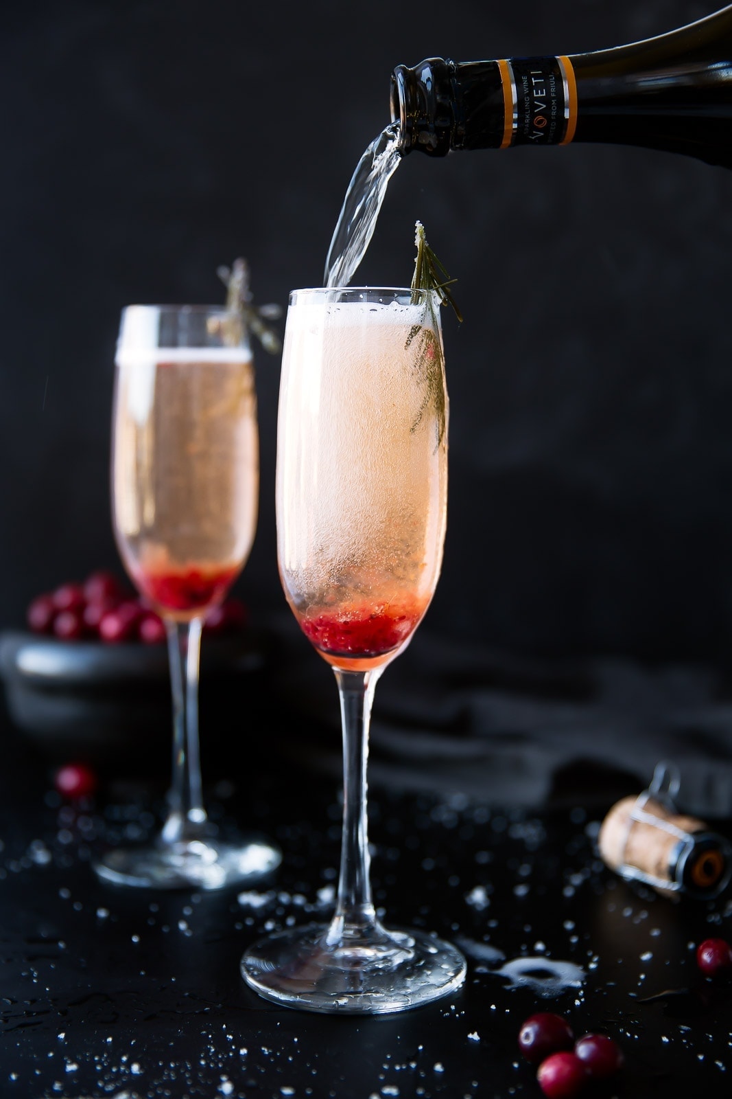 Almost as beautiful as it is easy, this Cranberry Orange Prosecco Cocktail with candied rosemary is sure to please!