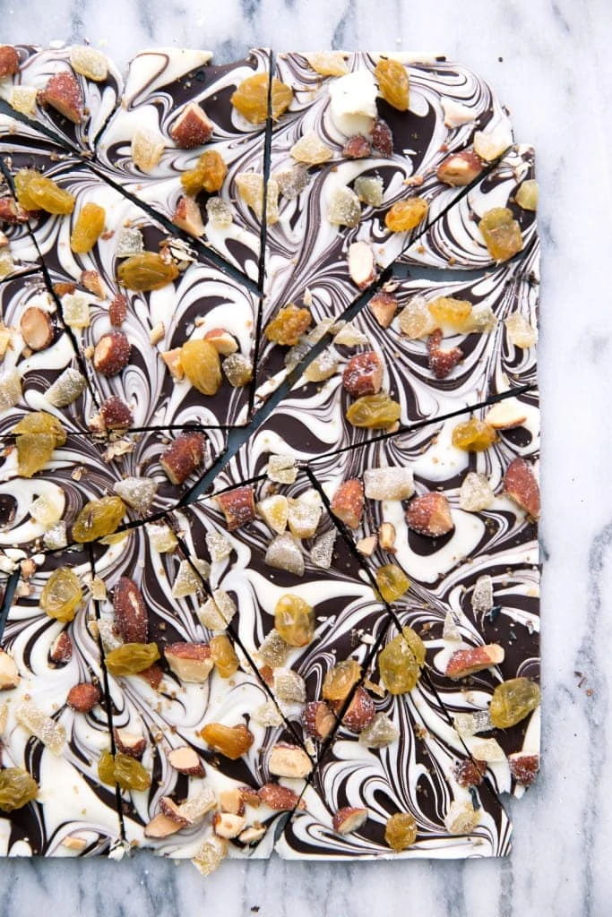 A festive dark and white chocolate bark with golden accents perfect for New Year's Eve!