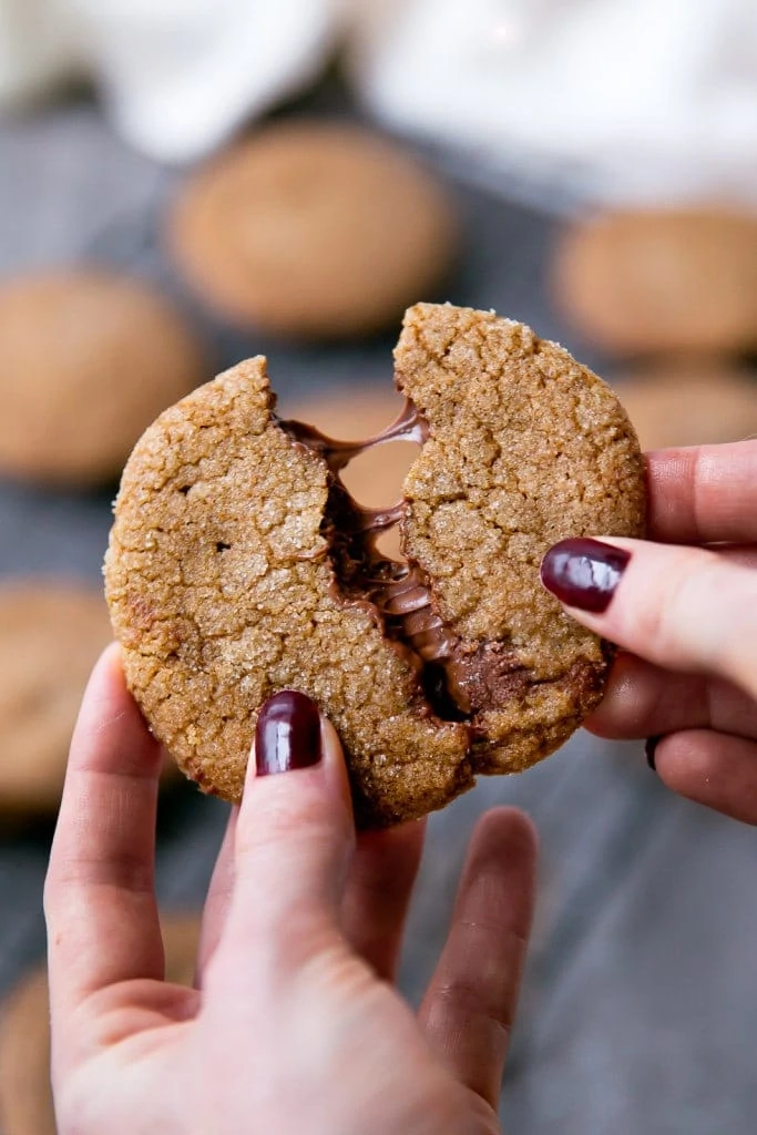 A thick and chewy gingersnap cookie with a gooey Nutella center.