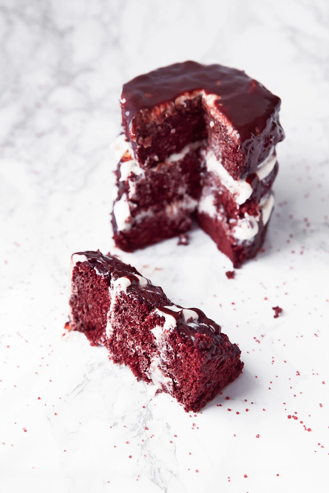 red velvet cake for two with a slice taken out