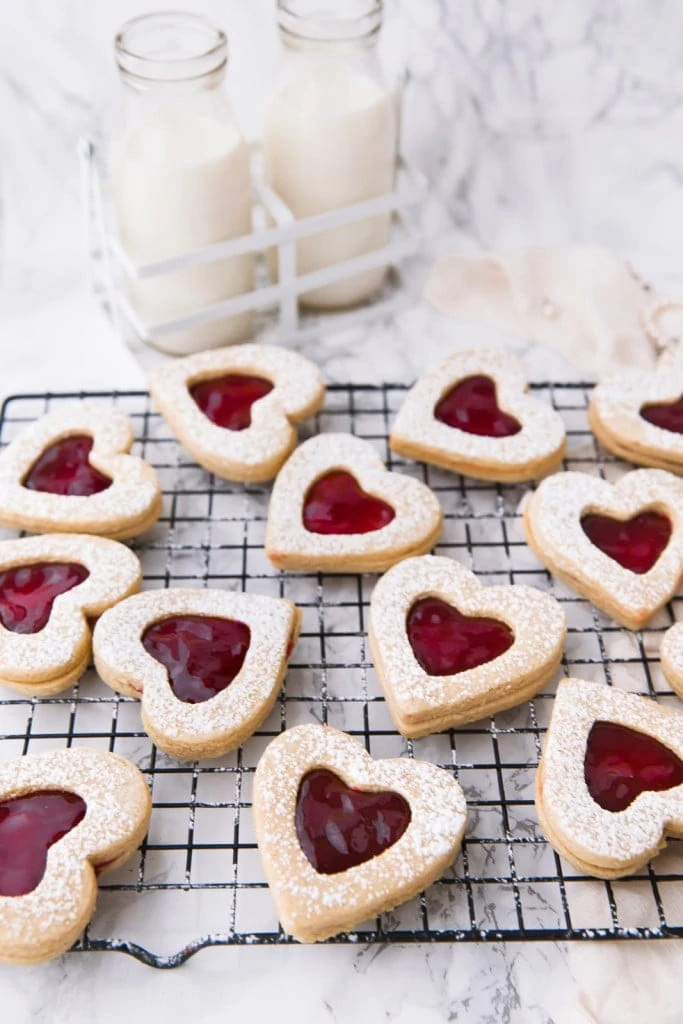 cherry linzer cookies on a wire rack