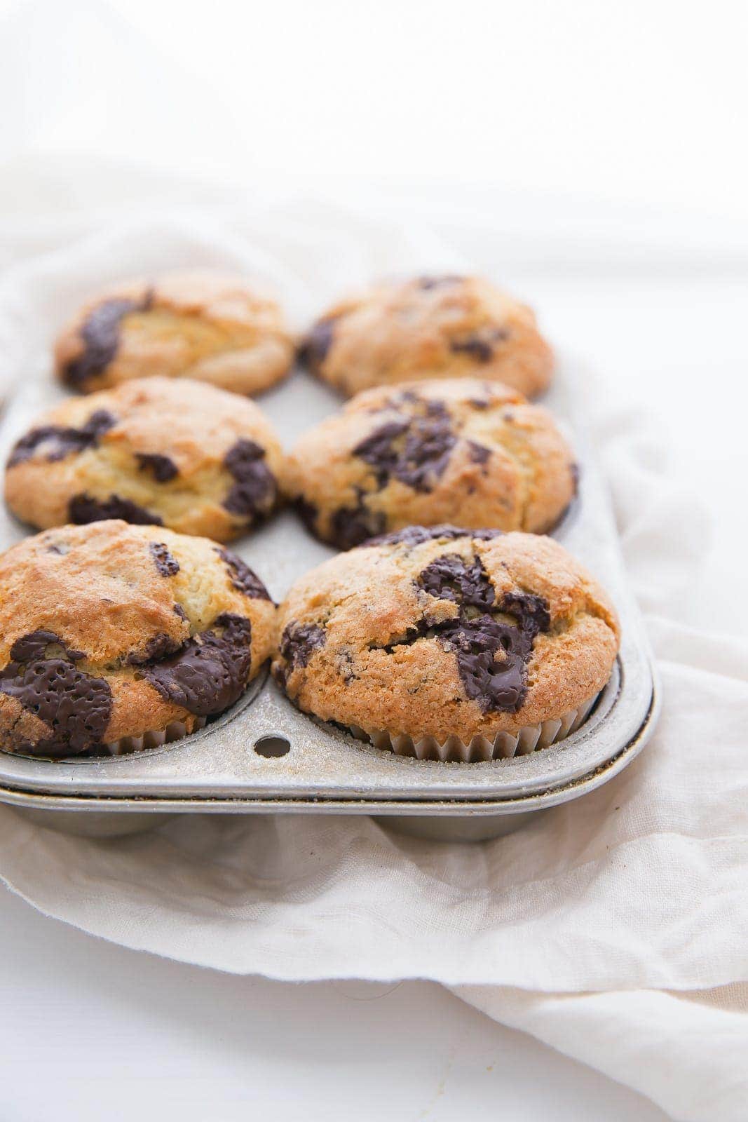 These bakery style chocolate chunk muffins are fluffy, buttery and just dense enough. Sounds like the perfect breakfast to me.