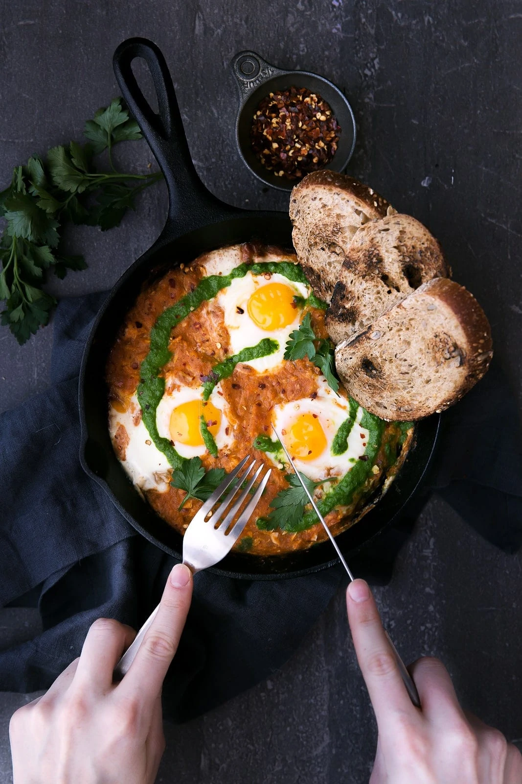 Say hello to shakshuka for breakfast: perfectly poached eggs in a spiced tomato sauce!
