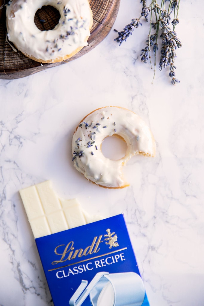 Celebrate spring with baked lemon donuts dipped in a lavender-infused white chocolate ganache!