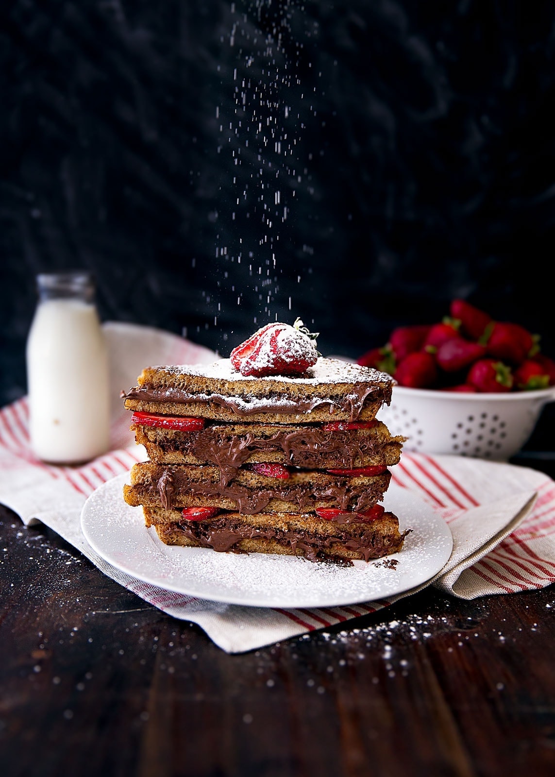 Custardy slices of french toast stuffed with rich and creamy Nutella and tart strawberries. Hubba hubba.