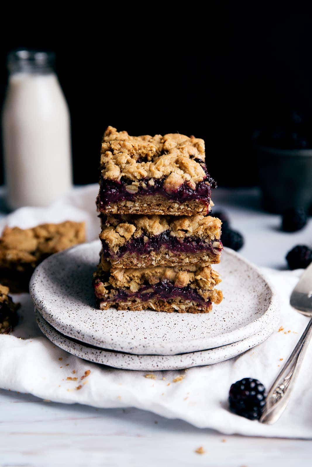 Chewy oatmeal bars with a homemade blackberry jam center and crumble topping
