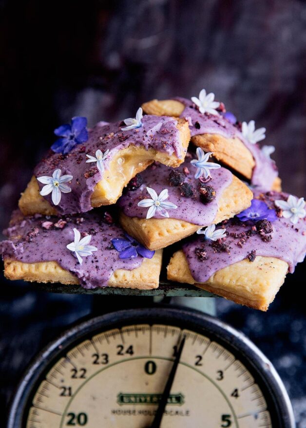 Celebrate spring (and breakfast time) with homemade lemon curd pop-tarts topped with a natural blueberry icing and edible flowers!