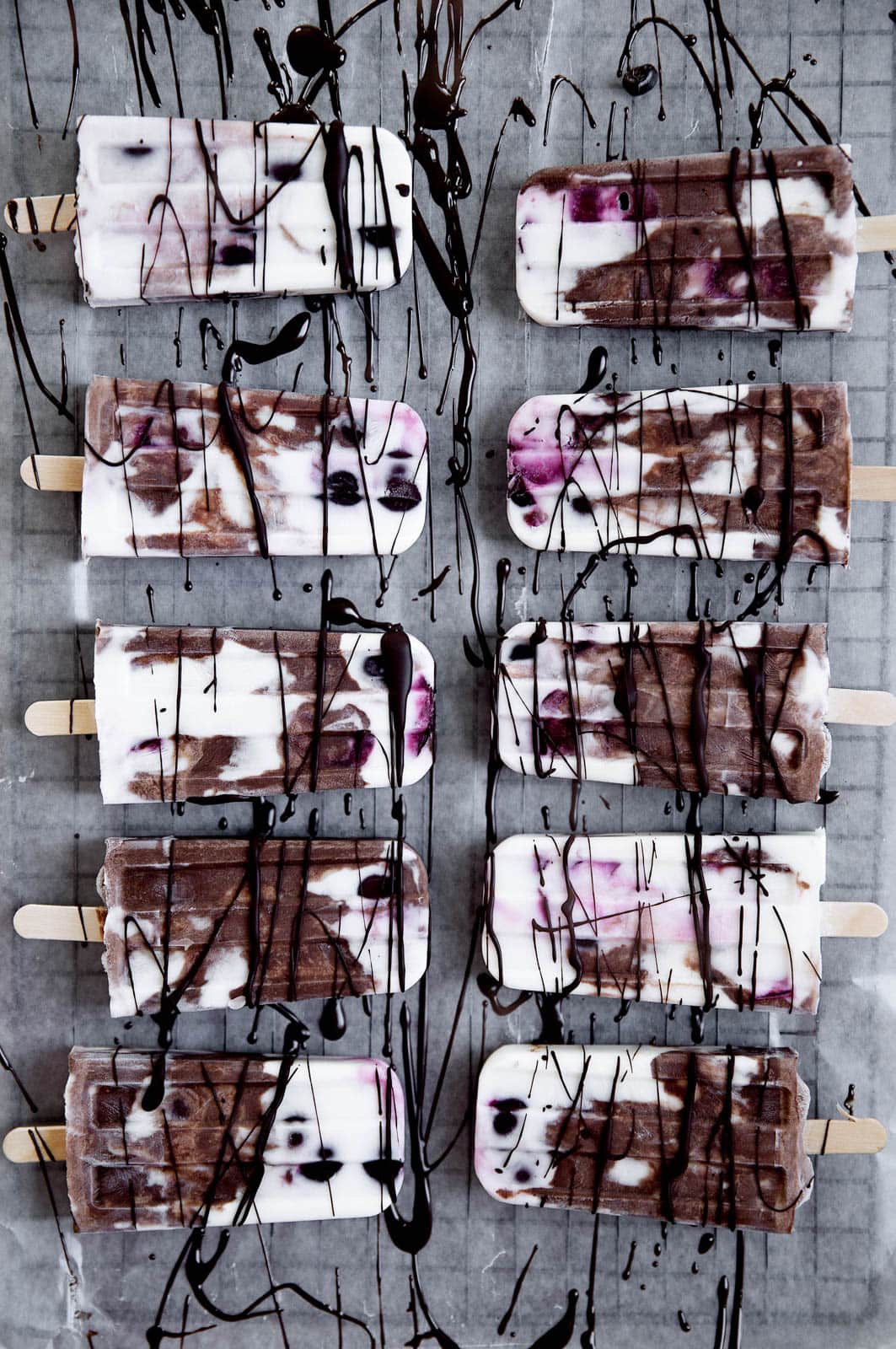 A mouth-watering combo of chocolate, fresh cherries, and vanilla will make these Black Forest Popsicles a smash hit at your next get together!