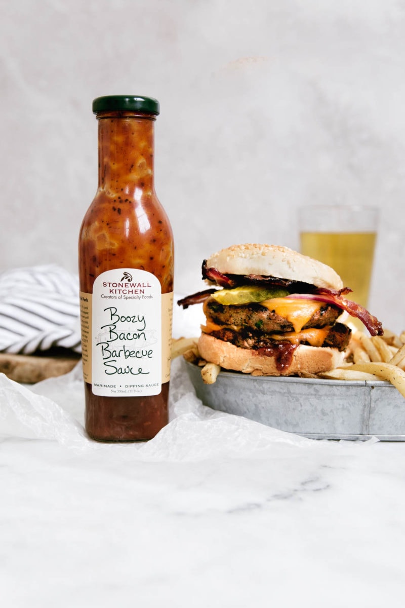 Bourbon Bacon BBQ Burger with a bottle of barbecue sauce