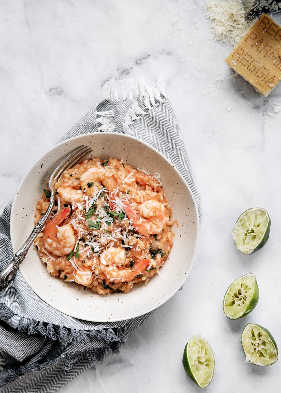 tomato and shrimp risotto with squeezed limes