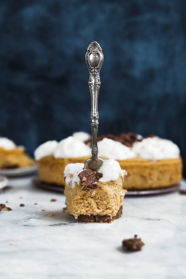 If pumpkin mousse and cheesecake had a lovechild it would be this fluffy cheesecake, sandwiched between a gingersnap crust and pumpkin pie spice candied pecans.