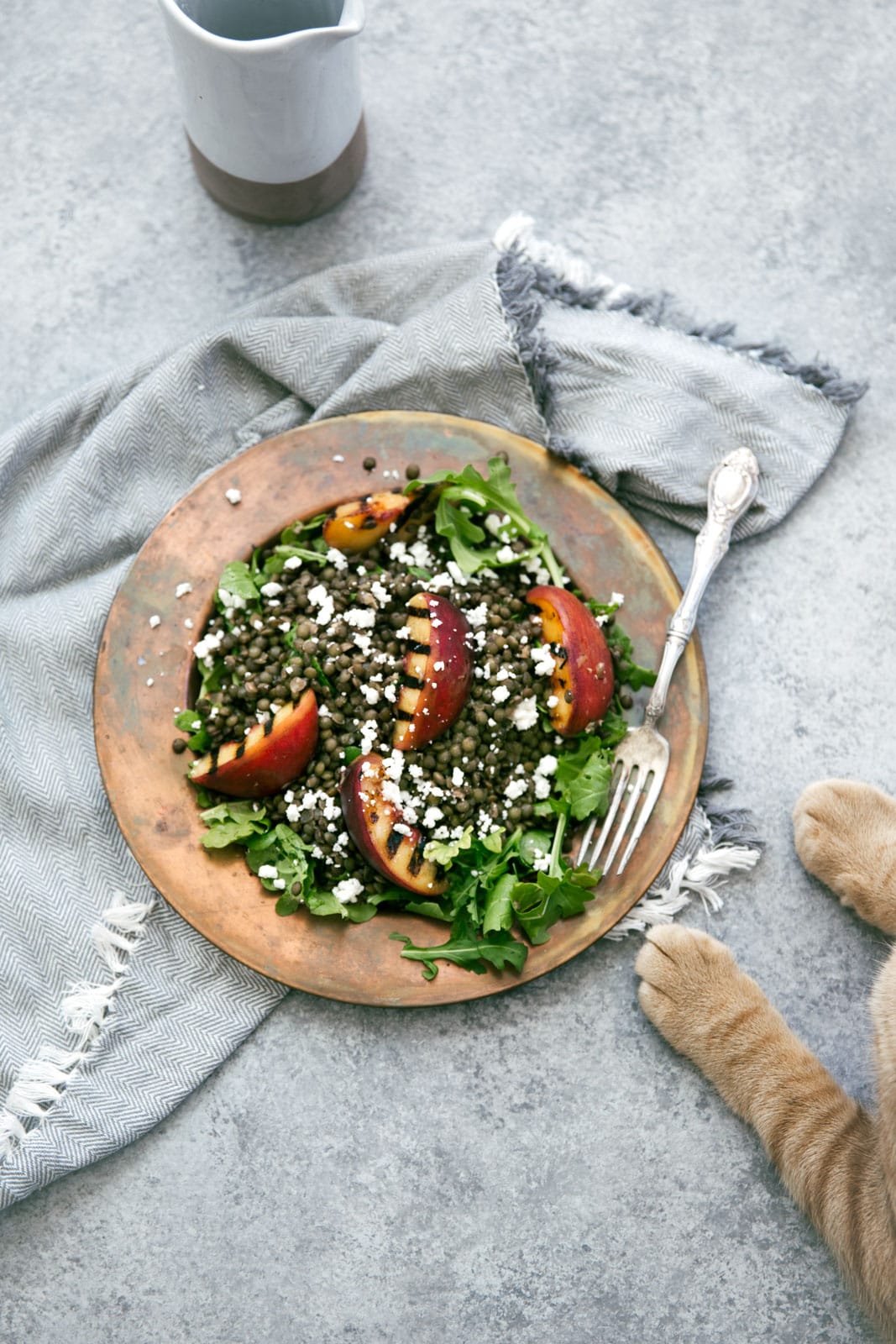 Take advantage of peach season with this green lentil salad with char-grilled peaches, goat cheese, and rosé vinaigrette.
