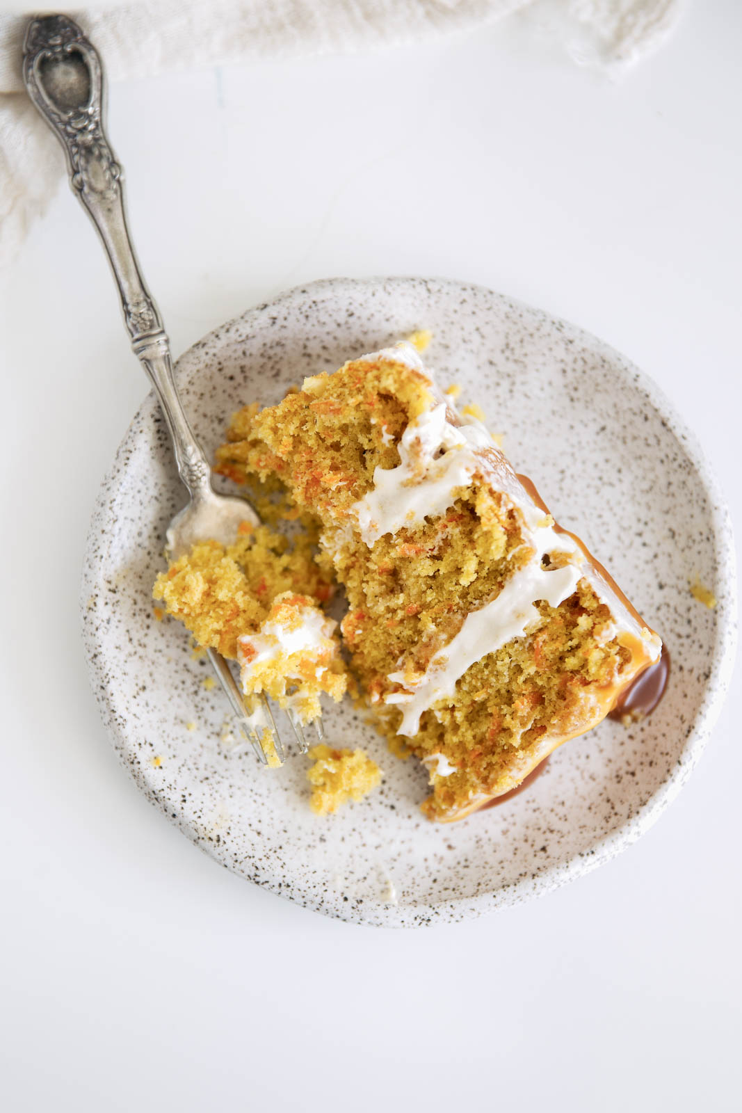 slice of spiced carrot cake on a plate