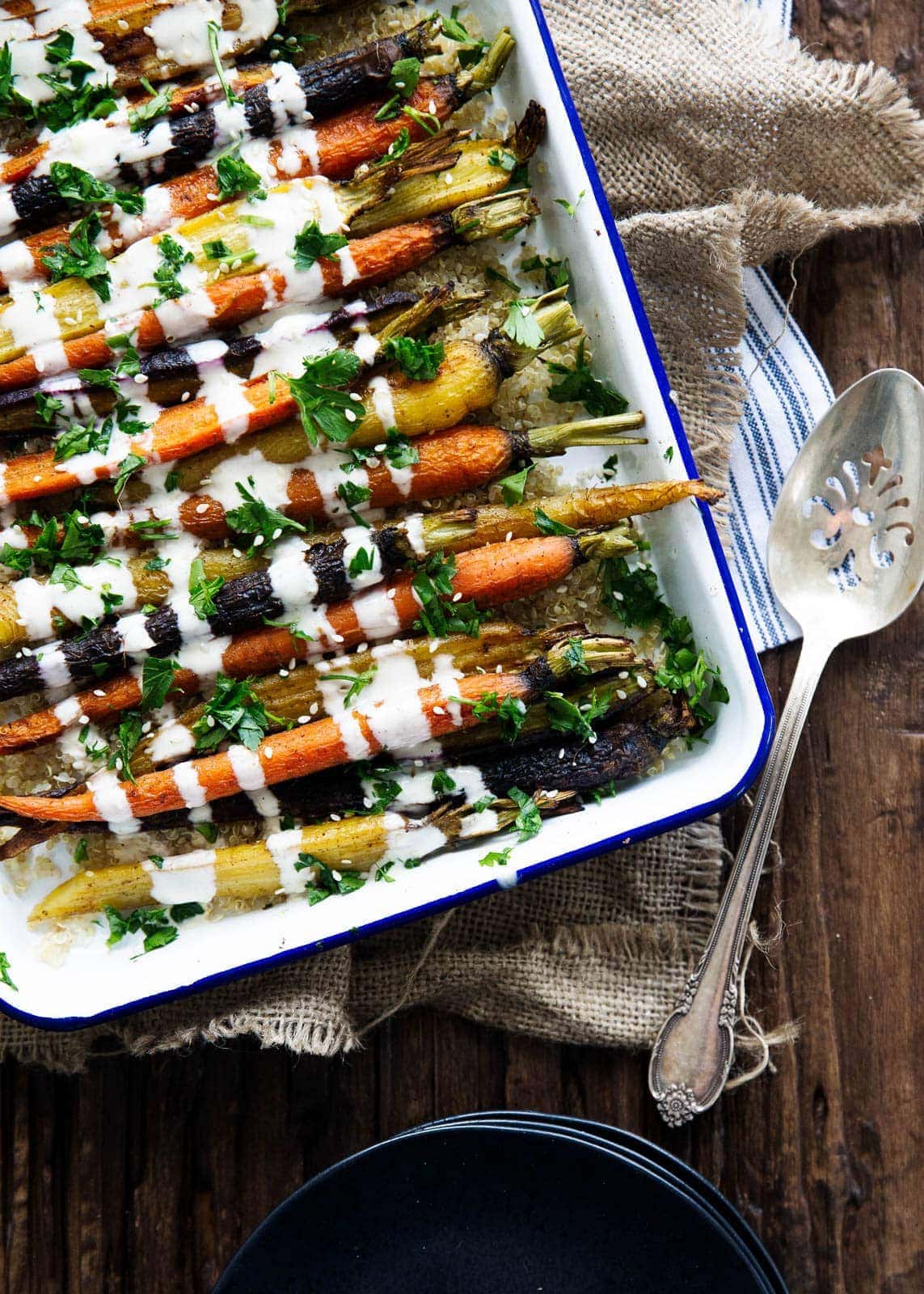 Cumin roasted carrots with tahini dressing are a perfect easy, delicious, and unique side for your holiday table!