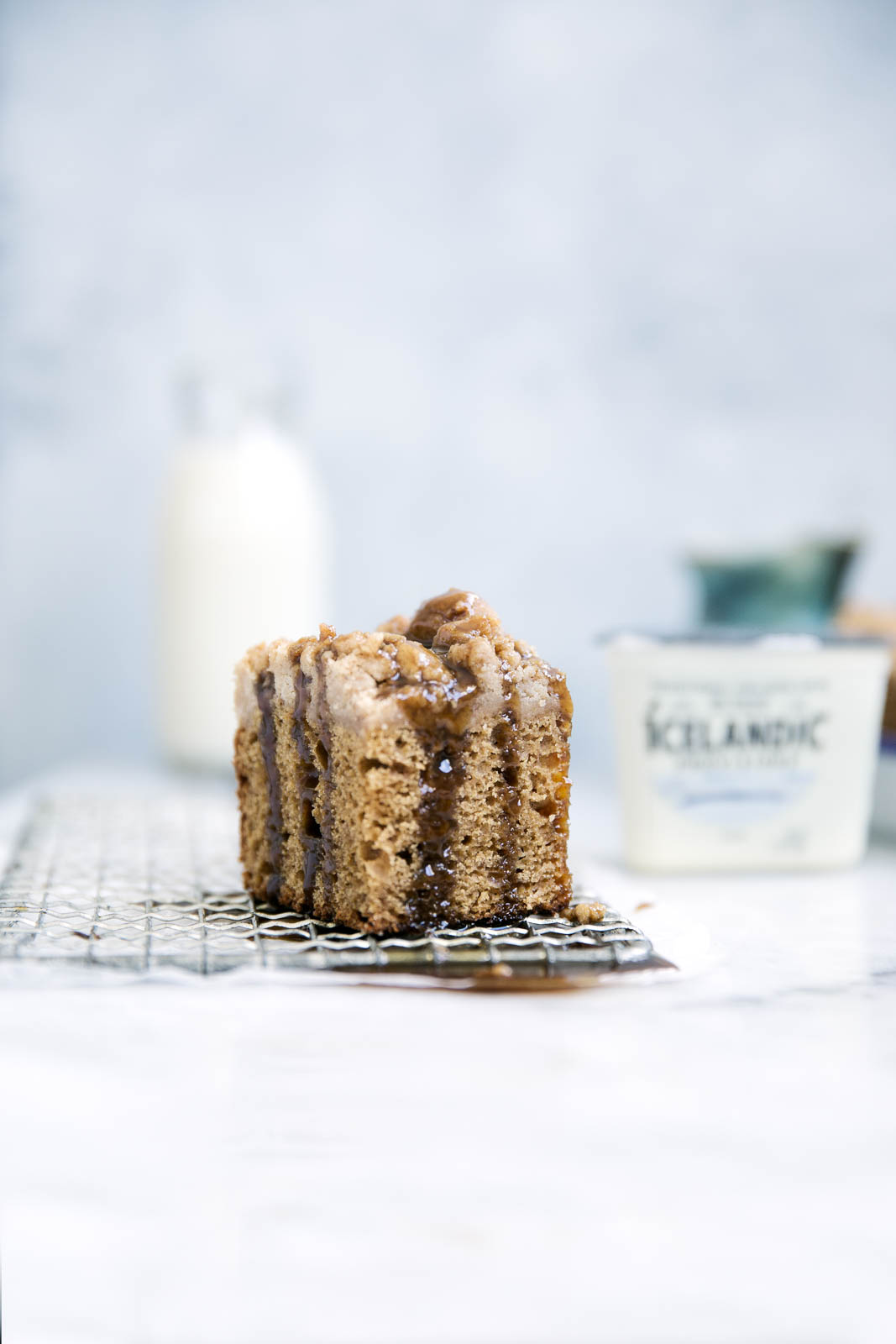 Perfectly spiced and super moist, this Icelandic skyr spice cake is topped with a ridiculously addicting crumb topping and toffee sauce!