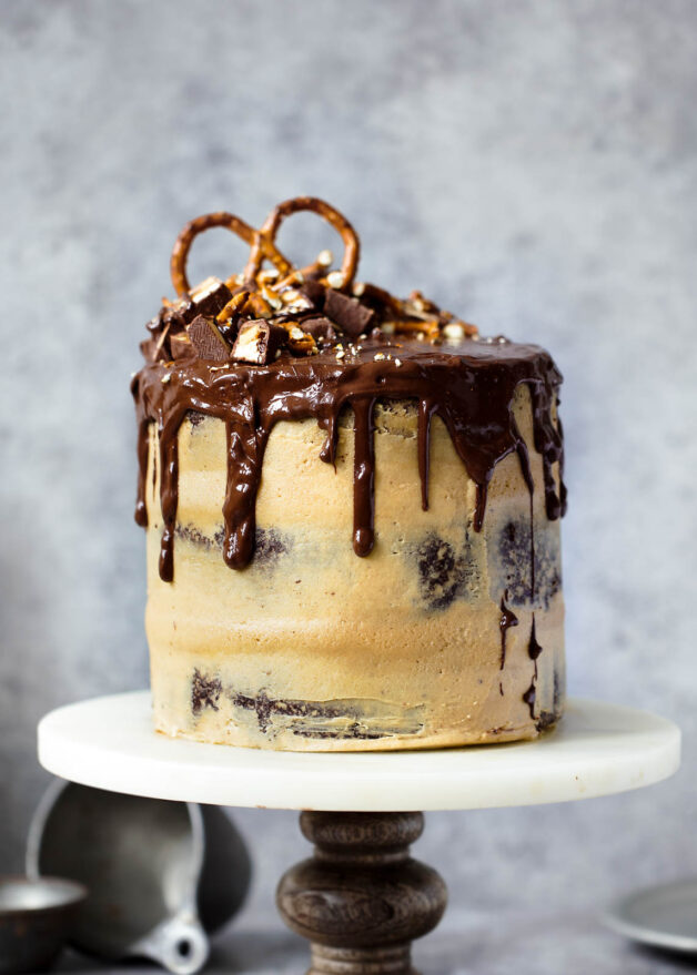 A boozy Chocolate Stout Cake topped with creamy peanut butter frosting and a chocolate ganache!