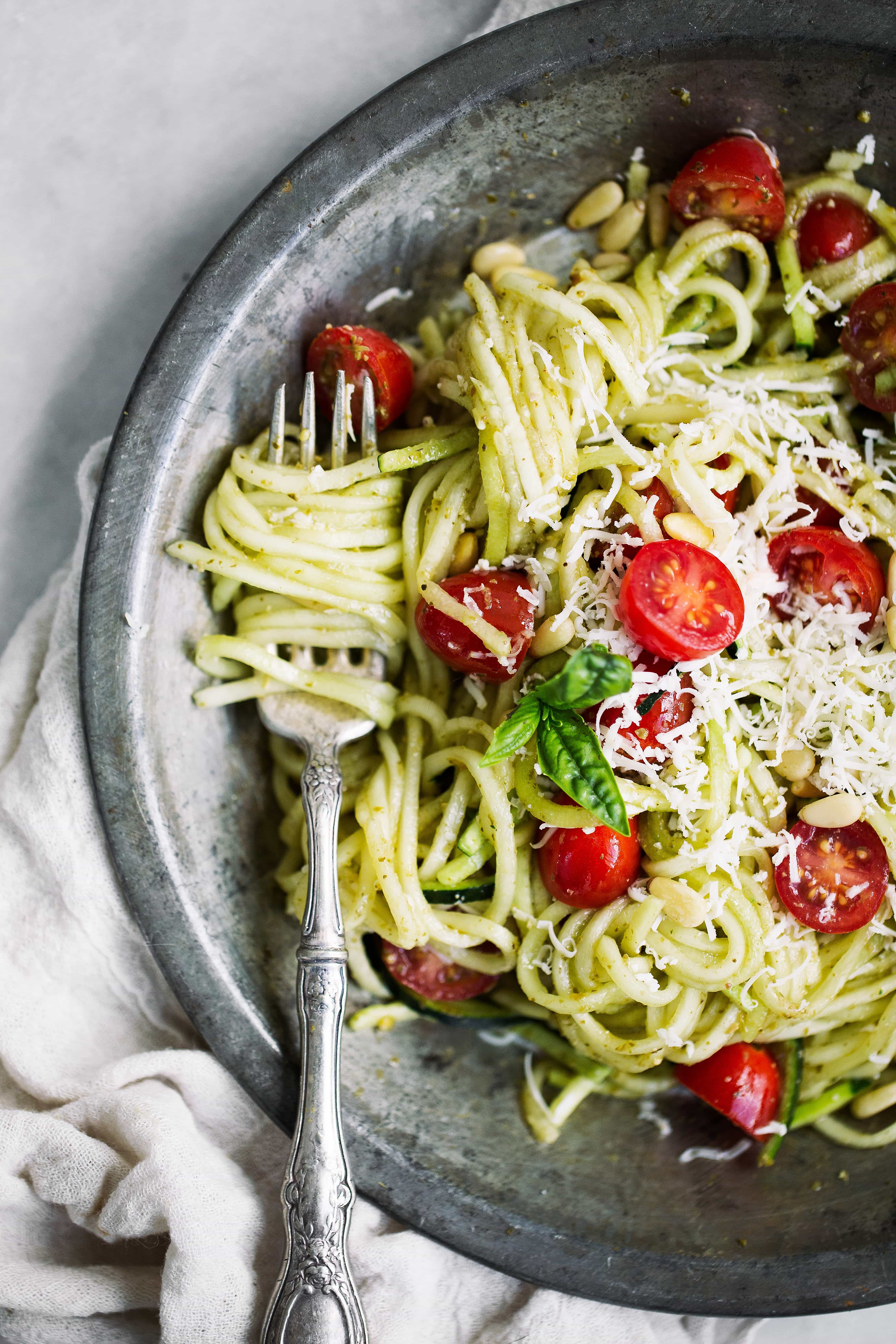 zucchini noodles with avocado pesto and tomatoes