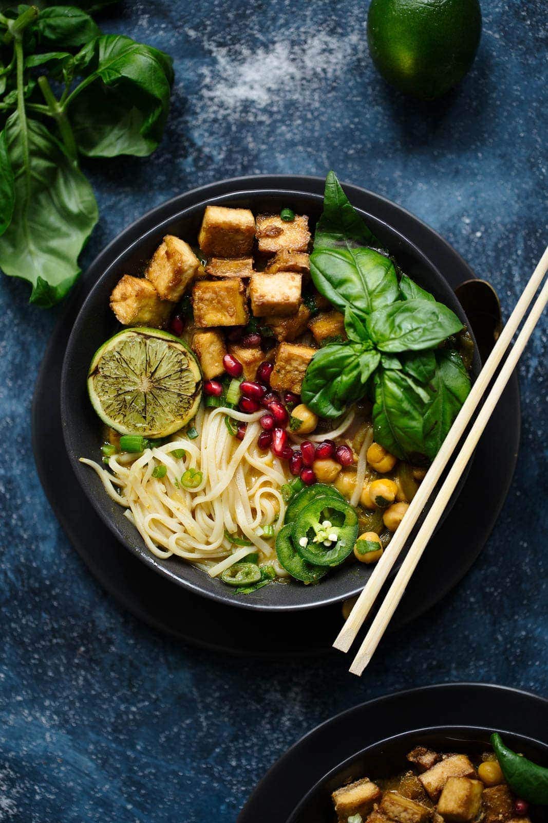 A Thai Coconut Curry Soup with crispy tofu, rice noodles, and tons of fresh basil.