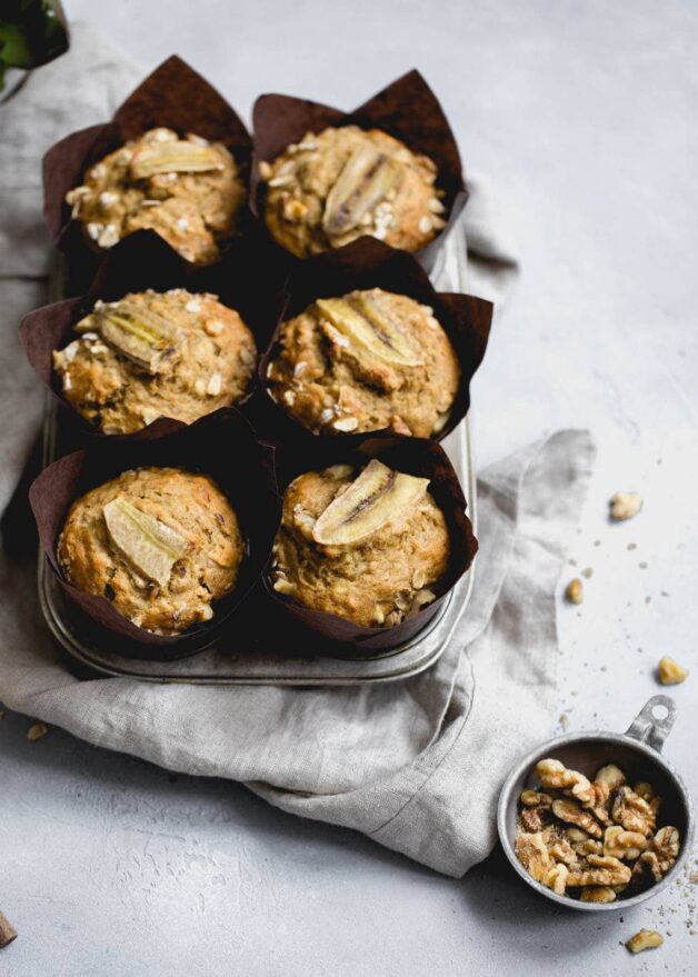 Magical Whole Wheat Banana Nut Muffins so moist and flavorful you won't even realize they're healthy!