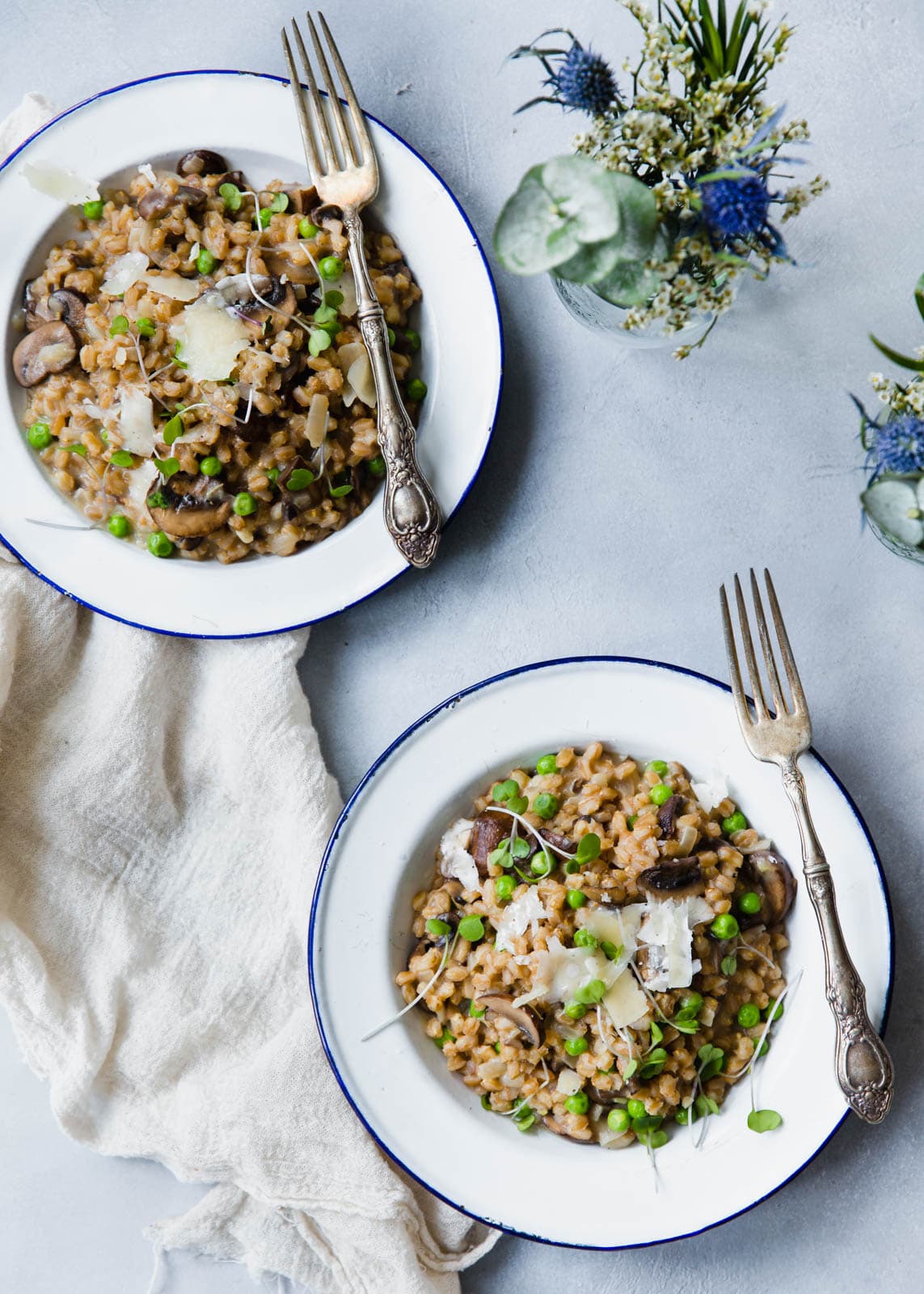 A warm and comforting farro risotto made with fresh spring peas and sautéed mushrooms!