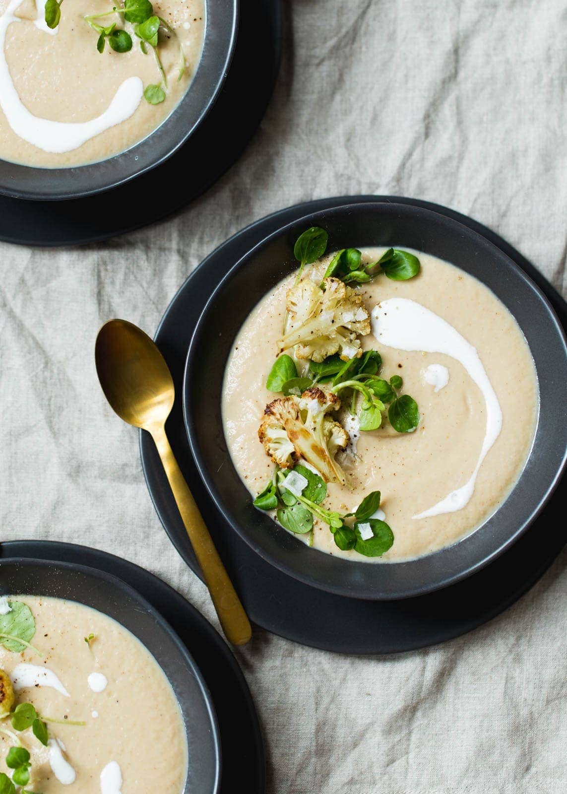 A healthy Cauliflower Soup made creamy from a secret ingredient with no added fat. Perfect warm or cold!