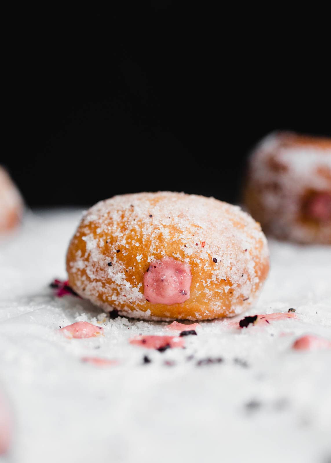 Golden and fried to perfection, these yeasted donuts are tossed in a hibiscus sugar and stuffed with a hibiscus pastry cream. Uhm, DROOL.