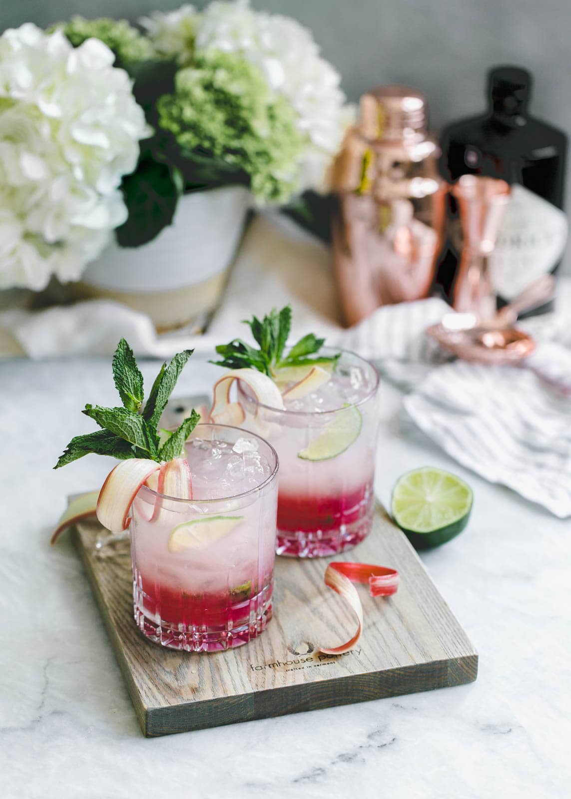 A thirst-quenching Rhubarb Mint Mojito made with rhubarb syrup, fresh mint, and lime. YUM.